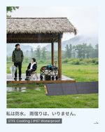 An IP67 waterproof ETFE coated ZOUPW 220W solar panel generating power out in the rain while campers watch from a pavilion.